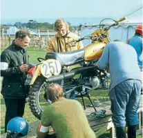  ??  ?? Right: Frame building legend Ken Sprayson scrutineer­ed for the ISDT in the Isle Of Man.