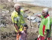  ??  ?? Villagers survey the aftermath of Severe Tropical Cyclone Winston on Nasau, Koro Island, in 2016.