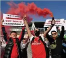  ??  ?? FLARE-UP Arsenal fans protest on Friday