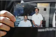  ?? JOHN RAOUX / AP 2017 ?? Eric Paddock holds a photo of himself (at left) and his brother, Stephen Paddock, (at right) outside his home in Orlando, Fla. An autopsy found Stephen Paddock had anti-anxiety drugs in his system.