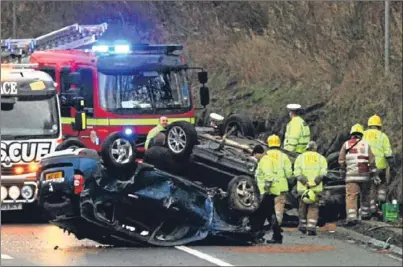  ?? Picture: Dougie Nicolson. ?? Three people suffered minor injuries when two cars overturned on the M90 on Saturday.