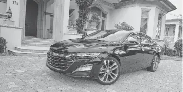  ?? HENRY PAYNE Detroit News/TNS ?? A 2023 Chevrolet Malibu 1LT. General Motors has announced that it will stop producing the Chevy Malibu this fall.