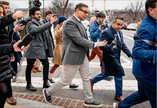  ?? Andrew Harnik / Associated Press ?? Rep. George Santos, R-N.Y., leaves a House GOP conference meeting on Capitol Hill in Washington on Wednesday. His campaign told federal regulators Wednesday it had hired a new treasurer, but as it turns out Thomas Datwyler actually turned the job down.