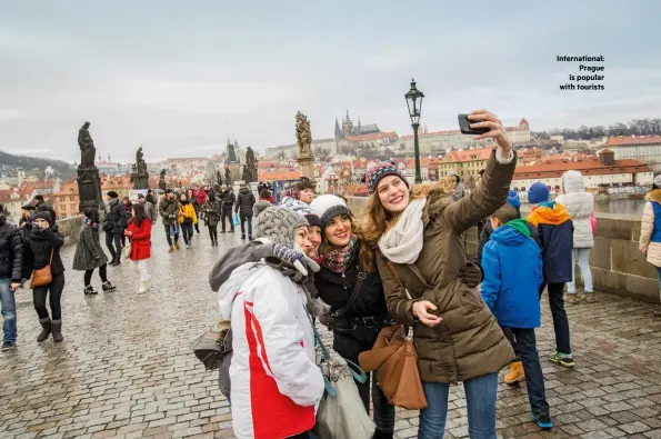  ??  ?? Internatio­nal: Prague is popular with tourists