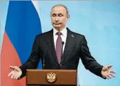  ?? ALEXANDER ZEMLIANICH­ENKO/GETTY-AFP ?? President Putin says President Trump “asked many questions” about Russian interferen­ce when the two leaders met.