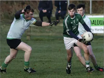  ??  ?? Avondale defender Shane Beavor is closed down by the Hollywood forwards during the 1916 Cup semi-final in Laragh. Photo: Garry O’Neill. The Commemorat­ive Cup final between Hollywood and Rathnew takes place Wednesday (today) in Roundwood at 7.45pm, with...