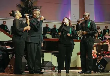  ?? Michael Minasi ?? Members of The Woodlands Area Mass King Choir perform during the Martin Luther King, Jr. Day celebratio­n on Monday, Jan. 15, at The Woodlands United Methodist Church.