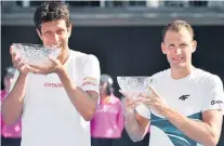  ?? PETER PARKS/AFP ?? Conquista. Marcelo Melo e Lukasz Kubot fazem a festa