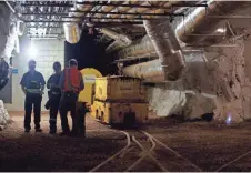  ?? AMBER HUNT, AP ?? Workers gather in a former gold mine that has been revamped into the sprawling Sanford Undergroun­d Research Facility nearly 4,900 feet beneath the earth’s surface in Lead, S.D.