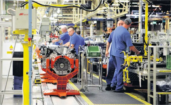  ?? David Jones ?? > Engineers at the Ford engine plant near Bridgend, where a ballot on industrial action is to be taken