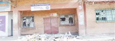  ??  ?? One of the shops that was looted and destroyed during violent demonstrat­ions in Bulawayo