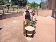  ?? Sarah Page Kyrcz/ For Hearst Connecticu­t Media ?? Standing in the middle the soon-to-be renovated senior center patio, alongside a planter that will soon be filled with flowers, are, from left, Courtney Burks, director of the senior center, and Ethan Franco, Life Scout from Boy Scouts of America Troop #38.