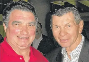  ?? PROVIDED ?? Hans Aeschbache­r (left) with one of his closest friends, the late Blackhawks great Stan Mikita.