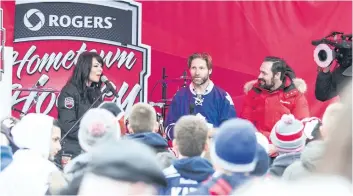  ?? BOB TYMCZYSZYN/STANDARD FILE PHOTO ?? Rogers Hometown Hockey co-host Tara Stone speaks with former National Hockey League players Shayne Corson and Darcy Tucker when the tour came through downtown St. Catharines in December 2014. It was announced Thursday the hockey festival will make its...