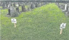  ??  ?? Pictured are the ‘no parking’ signs that Katrina Glenn has put up in Loughborou­gh cemetery after fearing that drivers might park on her sister’s grave.