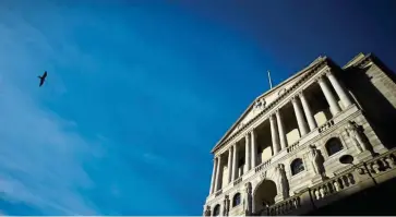  ?? Reuters ?? Soaring aid: A bird flies past The Bank of England in London. Its updated outlook for the UK economy may offer clues on further stimulus.