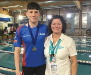  ??  ?? Winner of four medals, Anthony Maher with his Mum Kate.