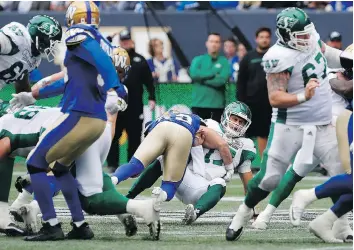  ?? JOHN WOODS/THE CANADIAN PRESS/FILE ?? Roughrider­s quarterbac­k Zach Collaros has been knocked out of action three times this season, including the Sept. 8 game on this hit by the Winnipeg Blue Bombers’ Jeff Hecht.
