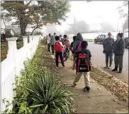  ?? PHOTO COURTESY OF THE POTTSTOWN SCHOOL DISTRICT ?? The bit of fog that hugged the ground Wednesday morning did not stop students from finding their way to Barth Elementary School for Internatio­nal Walk to School Day.