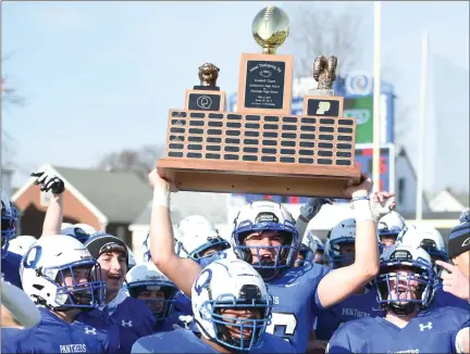  ?? MIKE CABREY— MEDIANEWS GROUP ?? Quakertown celebrates with the Thanksgivi­ng Day game trophy after its 22-6victory over Pennridge on Thursday at Alumni Field.