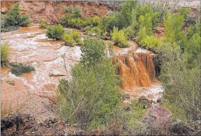  ?? Benji Xie ?? The Associated Press Flooding from a waterfall on the Havasupai reservatio­n in Supai, Ariz., is seen Thursday. About 200 tourists were being evacuated from a campground on tribal land near famous waterfalls.