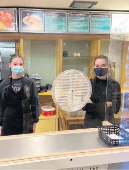  ??  ?? Team effort Beth Davidson and Caitlin Emmett help out at China China takeaway in Craigie Cross, Perth