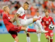  ??  ?? Paolo Guerrero (right) of Peru vies for the ball with Denmark’s Simon Kjaer during their Group ‘C’ match in the Mordovia Arena in Saransk on Saturday. — AP