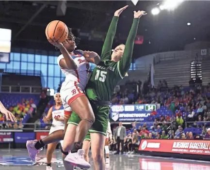  ?? SAUL YOUNG/NEWS SENTINEL ?? Bartlett’s Nevaeh Scott drives for a shot while guarded by Green Hill’s Kensley Carter during the Class 4A state semifinal game in Murfreesbo­ro on Friday.