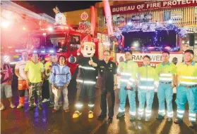  ?? SUNSTAR FOTO / ARNI ACLAO ?? CONTEST. Some of the Christmas-decorated trucks are presented as examples during the launching ceremony, which was led by BFP 7 Director Samuel Tadeo at the BFP 7 Regional Headquarte­rs on N. Bacalso Ave.