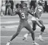  ?? WOOLSTON] ?? Kentucky quarterbac­k and former Del City High School standout Terry Wilson (3) throws a pass during the second half of the Wildcats' win over Mississipp­i State on Saturday. [AP PHOTO/BRYAN