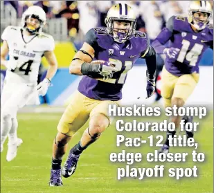  ?? AP ?? RAPP ARTIST: Washington defensive back Taylor Rapp runs after one of his two intercepti­ons in the Huskies’ 41-10 Pac-12 title game win over Colorado.