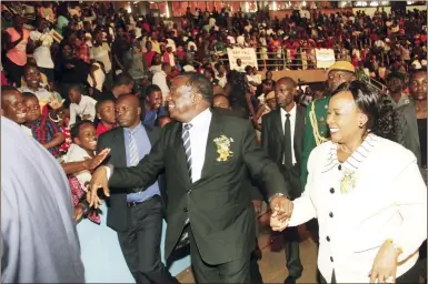  ?? — (Picture by John Manzongo) ?? President Mnangagwa and First Lady Auxillia Mnangagwa greet children on arrival for the 38th Independen­ce Day celebratio­ns children’s party in Harare yesterday.