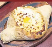  ?? MORGAN IONE YEAGER THE NEW YORK TIMES ?? Khachapuri is a traditiona­l egg and bread staple of Georgia.