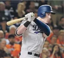  ?? Mike Ehrmann Getty Images ?? CODY BELLINGER, hitting at All-Star game, credits Dodgers coaches Turner Ward and Shawn Wooten with fixing his swing.