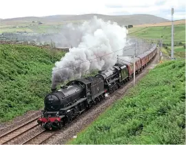  ??  ?? LNER K1 2- 6- 0No. 62005and ‘ Black Five’No. 45407 TheLancash­ireFusilie­rpass Greenholme on July 11, while heading fromCarnfo­rth to Carlisle on the first stage of the journey toFortWill­iam, inreadines­s for thedelayed startof202­0Jacobite season. DALE SMALLIN
