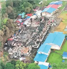  ??  ?? An aerial view of the razed longhouse.