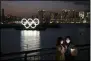  ?? JAE C. HONG - THE ASSOCIATED PRESS ?? Two women take a selfie with the Olympic rings in the background in the Odaiba section of Tokyo, Thursday, March 12, 2020. Doping testers around the sporting world are trying to avoid infecting themselves or athletes during the global virus outbreak, and that’s not easy when collecting samples means getting very close to sports stars.