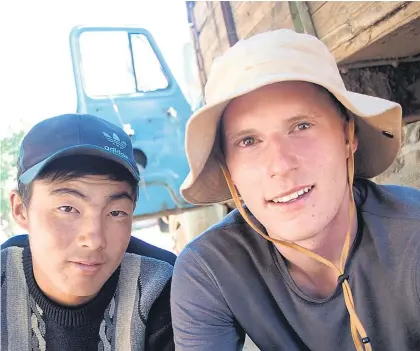  ??  ?? Peak to Plateau founder Stefan Warnaar (right) with a local in Kyrgyzstan, central Asia.