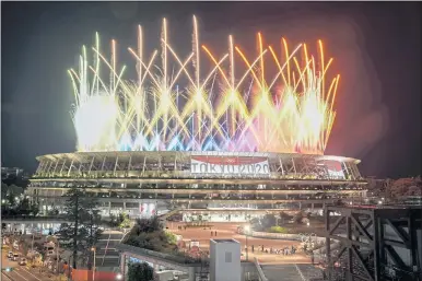  ?? KIICHIRO SATO — THE ASSOCIATED PRESS ?? Fireworks illuminate the sky above National Stadium during the closing ceremony of the Tokyo Olympics on Sunday.