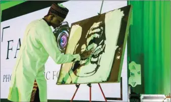  ??  ?? Fola Davis during live painting at City Hall, Lagos