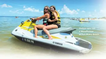  ??  ?? Visitors take out a WaveRunner at Fort Myers Beach.