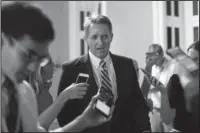  ?? The Associated Press ?? REASSERTIN­G INDEPENDEN­CE: Sen. Jeff Flake, R-Ariz. speaks to members of the media on July 13 as he walks to a meeting on Capitol Hill in Washington. There wasn’t a dramatic public break, or a precise moment when it happened. But little by little,...