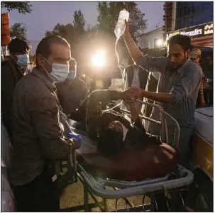  ?? (The New York Times/Victor J. Blue) ?? A person wounded Thursday in an explosion outside the airport in Afghanista­n arrives at a hospital in Kabul.