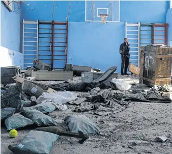  ?? REUTERS ?? A rocket is pictured inside a multi-sports court of a school, where, according to residents, Russian soldiers were based before the Ukrainian Army retook the Vilhivka village, amid Russia’s attack on Ukraine, near Kharkiv, Ukraine, Wednesday.