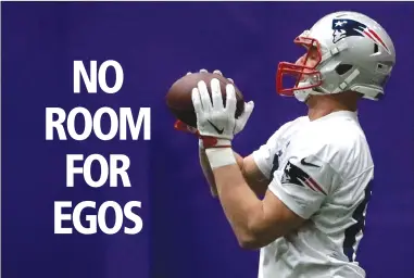  ?? Associated Press photo ?? New England Patriots tight end Rob Gronkowski warms up during a practice in Minneapoli­s.