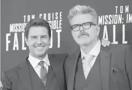  ??  ?? Tom Cruise, left, and Christophe­r McQuarrie set out to make Mission: Impossible — Fallout more character-driven, but ended up with more action sequences than ever before.