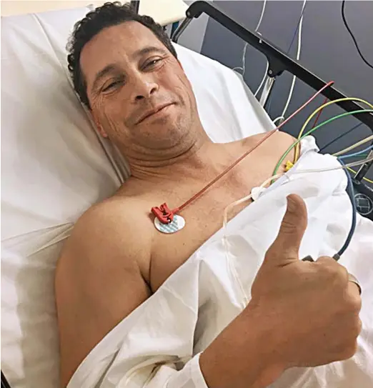  ??  ?? On the mend: Steven Woolfe gives the thumbs-up from his hospital bed in Strasbourg after his collapse in the EU parliament building