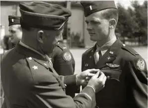  ?? (Photo courtesy of John Dibbs via “Mac” MacClarenc­e) ?? Lt. William “Mac” MacClarenc­e receives the Distinguis­hed Flying Cross from Fighter Wing Commander, Brigadier General Murray Woodbury, at Fowlmere, 1945.