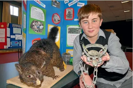  ?? JOHN HAWKINS/FAIRFAX NZ 634436369 ?? Verdon College student Ryan Conner, 12, with his science fair project ‘Man Vs Possum’ which is on trapping and possum control.