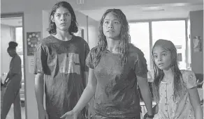  ?? PROVIDED BY PETER H. STRANKS/ NETFLIX ?? Gina Rodriguez plays a mom keeping her kids ( Lucius Hoyos and Ariana Greenblatt) safe in an apocalypse in “Awake.”